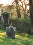 SX17380 Shadows and sunlight on gravestones at St David's Cathedral.jpg